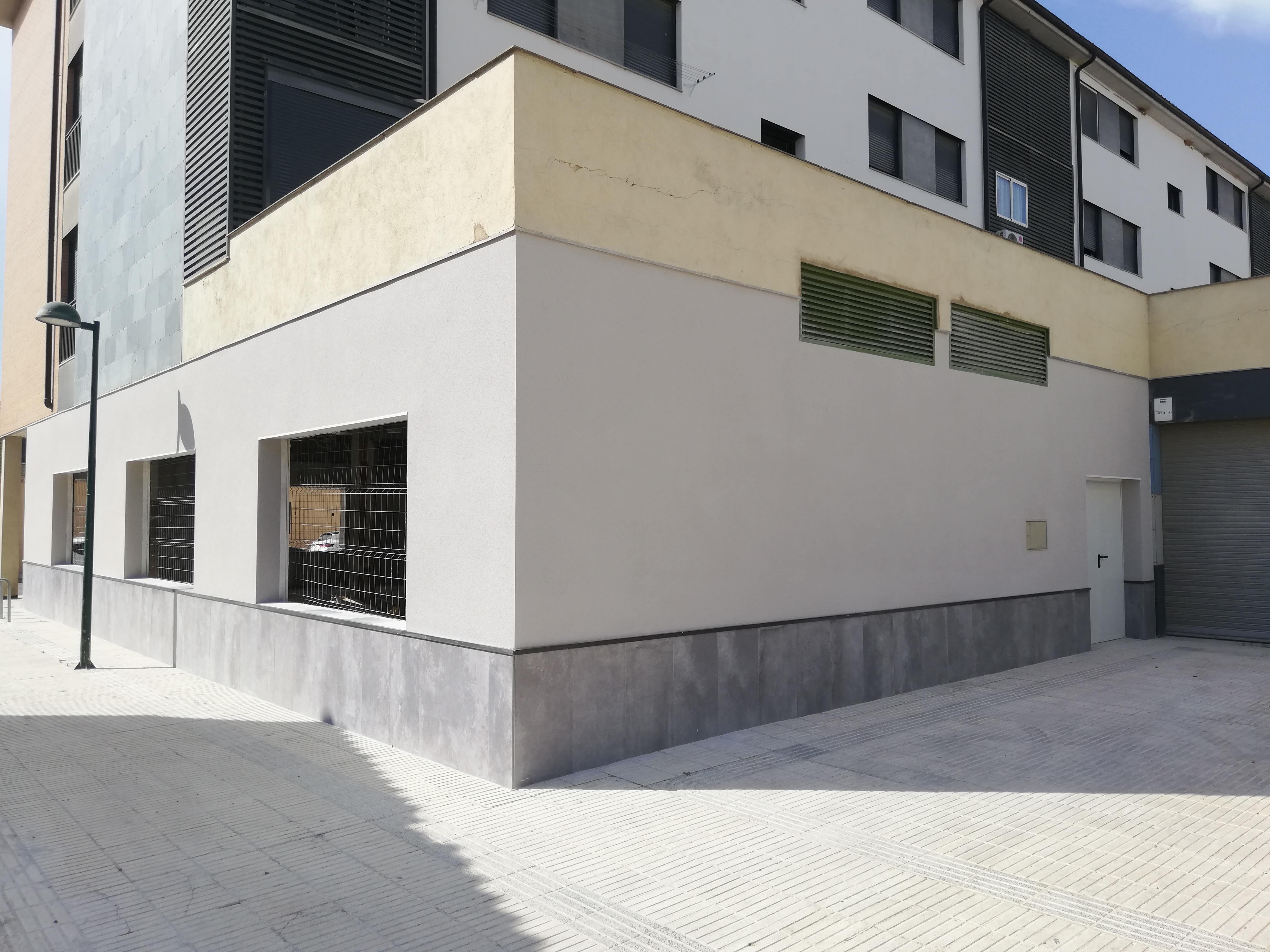 Fachada real rehabilitada con acabado exterior continuo